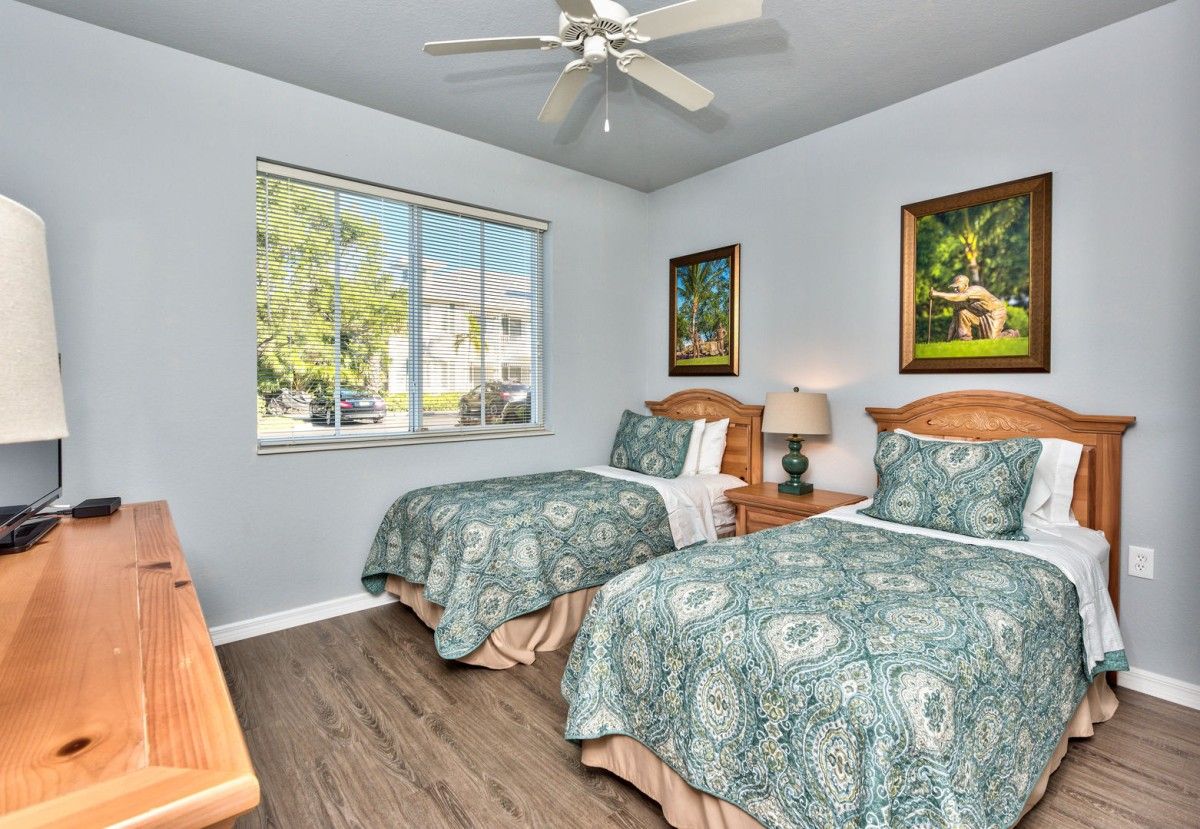 Vacation rental bedroom featuring two full-size beds